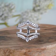 a diamond ring sitting on top of a wooden table