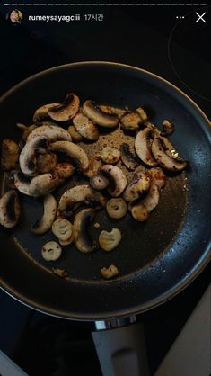 mushrooms are cooking in a pan on the stove