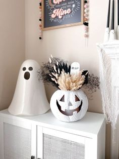 a white cabinet with halloween decorations on it