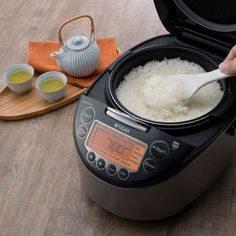 rice being cooked in an electric pressure cooker