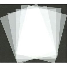 five sheets of white paper on a black background