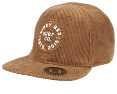 The Bintangs hat has an embossed "Binky Bro Surf Co" logo on the front. All panels and the bill are made from a lighter brown corduroy. The back snap is a matching brown color.  This hat comes in an infant, toddler, youth, and adult size. Co Logo, The Bill, Brown Corduroy, Crib Mattress, Girls Pajamas, Cubbies, Hat Shop, Baby Gear, Baby Hats