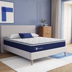 a blue and white bed in a room