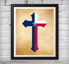 the cross is painted in red, white and blue on an old brick wall with a black frame