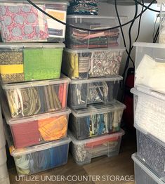 plastic storage containers are stacked on top of each other in this craft room organization area