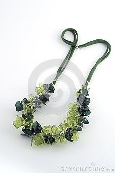 a necklace with green beads and flowers on a white background stock photo - image 3497