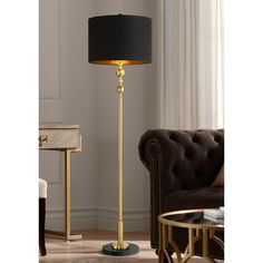 a black and gold floor lamp in a living room