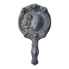 a metal spoon with an ornate design on it