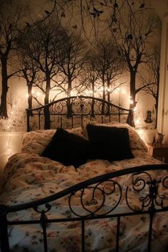 a bed that has some lights on the headboard and night time scene behind it