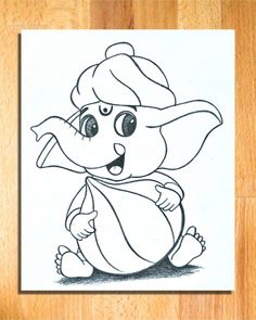 an elephant is sitting on the floor in front of a piece of paper that has been drawn