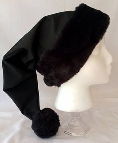 Please read to the very end for shop language and product description Unquestionably one of our most unusual and most popular hats. This solid black Christmas hat is made from black breathable cotton, lined with cotton, and features our exclusive black fur brim/flocking and pom pom, this hat is certainly a conversation piece. It is certainly a rarity to see a solid black Christmas hat, surely everyone will want to know where you got it from. (The Black Brim/flocking and pom pom can be substitute Black Cap For Winter Costume, Black Beanie Costume Hat For Winter, Black Beanie For Winter - Costume Hat, Merry Gothmas, Black Santa Hat, Black Christmas Tree Decorations, Santa Hat Png, Black Christmas Decorations, Popular Hats