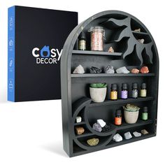 PRICES MAY VARY. UNIQUE SUN & MOON SHELVING: With the crescent moon and radiant sun built-in designs, this display shelf is perfect for anyone looking to add a touch of magic to their home. The endless rows of shelving and mini cubbies will create the perfect home to all your small trinkets and treasures. MULTIPURPOSE STORAGE SHELF: Our boho shelf is designed to hold a variety of small items including crystals, essential oils, small plants, candles and more! Take those treasured items out of sto Sun Moon Design, Spiritual Room Decor, Crystal Display Shelf, Spiritual Room, Black Metal Wall Art, Crystal Shelves, Crystal Holder, Crystal Display, Witch Decor