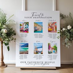 a white sign sitting on top of a wooden floor next to vases filled with flowers