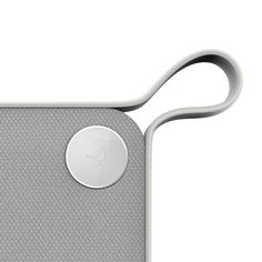 the back side of an ipod case with a metal button on it's side