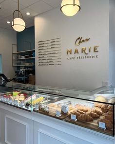 a display case in a bakery filled with pastries