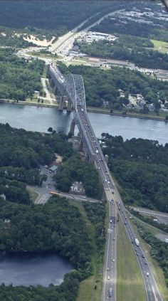 an aerial view of a highway and bridge