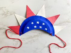 a paper plate with red, white and blue decorations on it