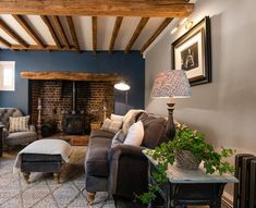 a living room filled with furniture and a fire place