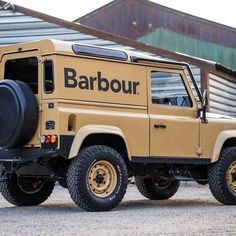 a tan truck parked in front of a building