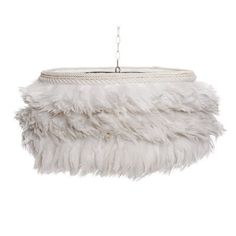 a white feather lamp hanging from a ceiling