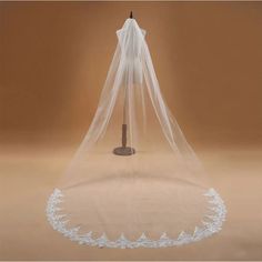 a white wedding veil on top of a table