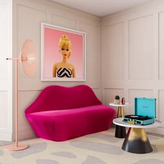 a living room filled with furniture and a pink couch next to a painting on the wall