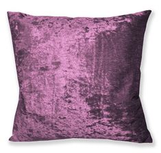 a purple velvet pillow on a white background