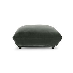 the footstool is made from dark green velvet