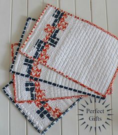 three quilted coasters sitting on top of each other