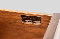 a wooden cabinet with a label that says harry probber on the front door