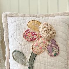 a decorative pillow with flowers on it