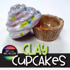 two clay cupcakes sitting next to each other