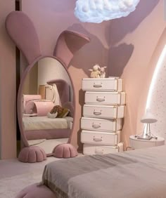 a bedroom with pink furniture and clouds painted on the wall