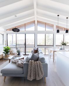 a living room filled with furniture and a flat screen tv