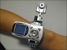 a close up of a person's arm with a wrist watch on top of it