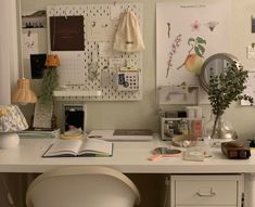 a white desk topped with an open book