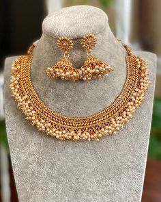 Gold Necklace/ Indian Jewelry/ Indian Necklace/ Adjustable Gold plated Pearl Necklace/ Indian Gold Necklace Set/ Indian Wedding Jewelry Gorgeous 22 K gold plated. Perfect for Indian weddings. Size- Adjustable All the raw material used in this product is of high quality and is handcrafted with love. Premium Quality and High craftsmanship 100% Satisfaction Guarantee: Long Lasting Plating, High-Quality Stones. Gifting: This pair of charming necklace and earrings come in a beautiful gift box, making Choker Necklace Indian Gold, Indian Gold Necklace Set, Gold Choker Necklace Indian, Gold Necklace Set Indian, Indian Gold Necklace, Choker Necklace Indian, Guttapusalu Necklace, Choker Pearl Necklace, Choker Pearl