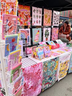 there are many cards on display at the market