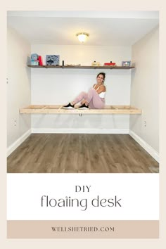 a woman sitting on top of a wooden shelf