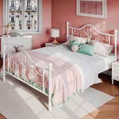 a bedroom with pink walls and white furniture