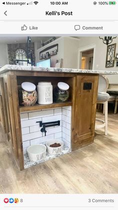 a kitchen island made out of an old cabinet and some buckets on the counter