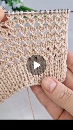 the video shows how to crochet an object with yarn and cotton, as well as knitting instructions