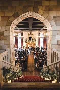 an overhead view of a wedding ceremony with the bride and groom walking down the aisle