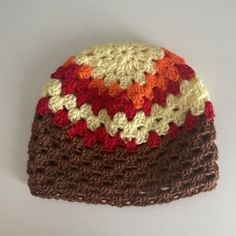 there is a crocheted hat on the table