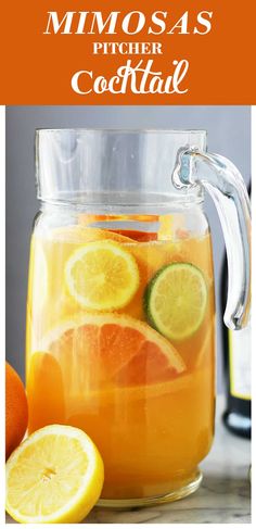 a pitcher filled with lemonade and orange slices