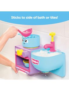 a child's bathtub with toys in it and the words stick to side of bath or tiles