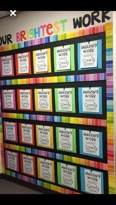 a colorful bulletin board on the wall in an office cubicle that says our brightest work