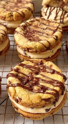 cookies with chocolate drizzle and frosting on cooling rack