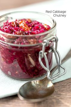 red cabbage chutney in a glass jar with spoon