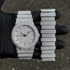 Step into elegance with this fully iced-out diamond watch and staggered bracelet set that mirrors genuine luxury watches. We utilize premium simulated diamonds crafted from high-refractive crystals, ensuring a sparkle that rivals authentic diamonds under the light! INCLUDES AN EASY-TO-USE SIZE ADJUSTMENT TOOL Specifications: - Gender: Men's - Case Size: 46mm - Sizing: 8.5-inch band - Bracelet Length: 9-inches (Non-adjustable) - Movement: Quartz Movement - Battery: Included - Adjustable: Watch Li Luxury Watches, Silver Watches, Vvs Diamond, Watches Unique, Band Bracelet, Diamond Watch, Bracelet Length, Silver Watch, Silver Bracelets